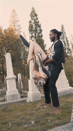 Ruby May on Instagram: "Balancing between worlds….. where bones learn how to flyyyy 💀🌸 #DiaDeLosMuertos #DayOfTheDead #SkeletonDance #GraveyardAcro #SpookySeason #AcroYoga #MementoMori #SpiritsRise #HalloweenVibes #DanceOfTheDead"