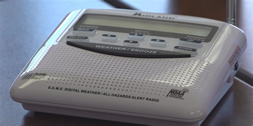13′s Chief Meteorologist Jeremy Goodwin programs weather radios for community members