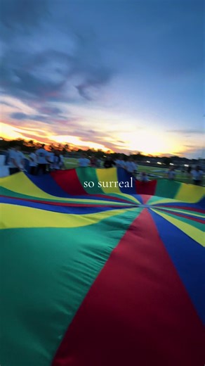 Surreal Graduation Moment: Senior Sunset Parachute