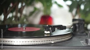 vinyl record spinning. close up of needle playing record album on a vintage turntable. Old school record player