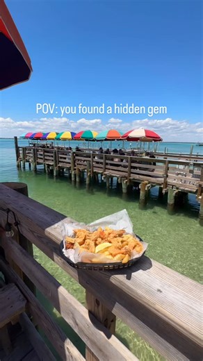 Tucked away by the Marler Bridge in Destin, FL… is a locals favorite and a Destin staple 🦐 @deweydestinsoriginal is old-school coastal Florida—pull up by boat, kick off your shoes, and watch sea critters swim by while you dive into fried shrimp, royal reds, award-winning gumbo, and the hush puppies dreams are made of. No frills, just fresh. #todoindestin #lunchwithaview #instagram #foodiereel #viral #reel #boatdayvibes #boatday #destineats #destinlunch #seafood #seafoodrestaurant | Dewey Destin