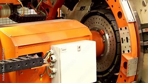 Tire manufacturer robotic equipment at the tires plant in process of tire forming