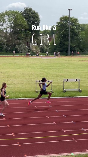 Fast Girl Sprinting in Track and Field Relay