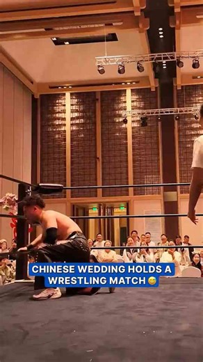 Newlyweds settle housework duties with wrestling match at wedding