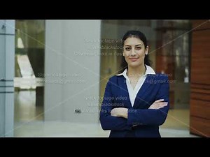 Portrait of successful businesswoman smiling and looking into camera in modern office
