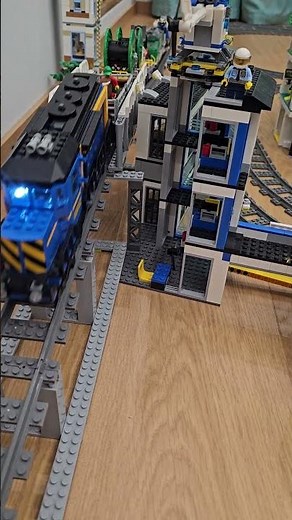 LEGO train action: freight on the bridge, police station in view!