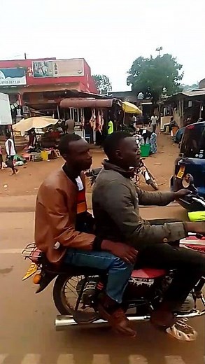 Different categories of businesses carried out in Uganda alongside the road.