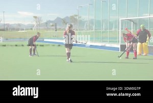 Hockey whistle signaling play, attacker placing ball, defenders sliding tackle, keeper lunging save. Action, competition, athleticism, teamwork, outdoor, intensity, strategy Stock Video Footage - Alamy