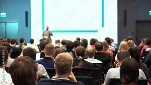Business People Seminar Conference Meeting Office Training Concept. Business people sit and listen to the lecturer in the large conference hall. Discuss the problems of economics and politics.