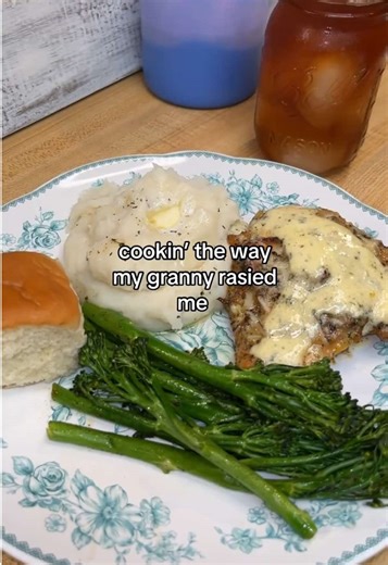 Oven-Baked Garlic Parm Chicken, Baby Broccoli, and Mashed Potatoes with Recipe: Use whatever cut of chicken you like; I am using bone-in chicken breasts because the bone helps keep the meat juicy and adds extra flavor. Pat the chicken dry to remove excess moisture, which helps the skin crisp up, then drizzle with oil and season generously with your favorite seasoning. I like to add a splash of hot sauce for a subtle kick and about one teaspoon of baking powder on the skin to help it get extra cr