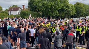 Protesters clash with police outside hotel housing asylum seekers in Essex