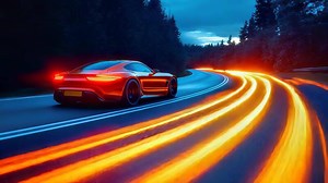 Download A sports car driving on a road at night background for free