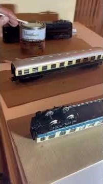 Marklin train car modification for standard HO tracks