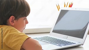 Student diligently does homework on his laptop. This common scenario highlights reality of remote homework, suitable for projects on modern student life and everyday education routines.