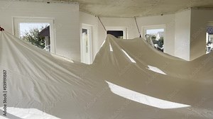 Stretch ceiling installation during home renovation. Stock Video