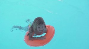 Little Girl Swims On Inflatable Ring Stock Footage Video (100% Royalty-free) 1110717995 | Shutterstock