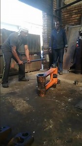 THOR'S POWER IN THROWING HEAVY MANUAL HAMMER DURING EXCAVATOR'S END BOSS REPAIR