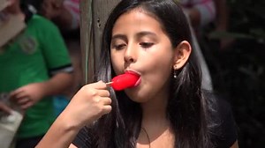 Young Girl Eating Popsicle