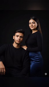 AI COUPLE PROMPT 🦋🥰 👇 A cinematic, ultra-realistic couple portrait of a stylish young Indian couple. The woman has long, smooth dark hair styled neatly, glowing fair skin, soft makeup with glossy lips, wearing an elegant black long-sleeve top paired with a deep navy satin skirt, standing gracefully with a confident smile. The man has sharp facial features, well-groomed beard, expressive eyes, and styled dark hair, wearing a black textured sweater, sitting slightly leaned back with a calm, int