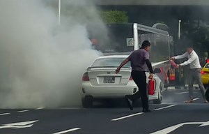 SBS Transit bus driver stopped mid-ride, sought passengers' permission to put out fire on road
