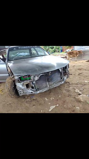 Car Repair Process: Welding a Damaged Sedan