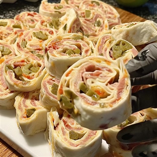 Mexican Tortilla Pinwheels My Nana used to prepare this every year for us kids, and now I make sure the tradition continues. It takes only a little effort, but the result is unforgettable. It’s one of those nostalgic homemade snacks you can’t find in stores, so it stays a family treasure. Whoever first shared it with us, we owe them a big thank-you. Ingredients: 4–5 large flour tortillas 8 ounces cream cheese, softened 1 cup shredded cheddar cheese 1/2 cup diced green chiles (drained) 1/2 cup di