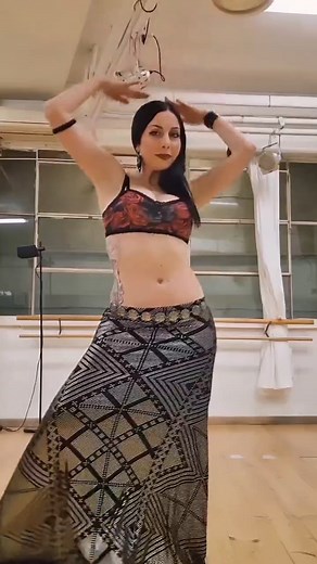 the Mesmerizing Belly Dance Artist - A captivating dancer whose every move embodies the essence of Arabic dance and the allure of Shakira-style performances. With graceful shimmy that evokes the rhythm of the desert, enticing belly rolls that ripple like waves, and magnetic belly flutters that leave spectators spellbound, this dancer creates an enchanting spectacle of sensuality and grace. From their alluring musically belly dance videos to captivating belly dance TikTok content, their passion f