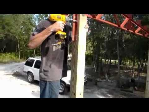 Build your own carport with steel trusses.