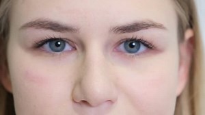 Portrait of a model girl who opens her eyes wide and looks at the camera. People style concept