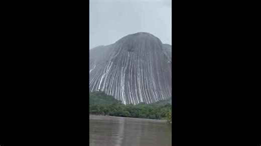 Heavy rainfall creates waterfall-like streams over Mavecure Hills in Colombia