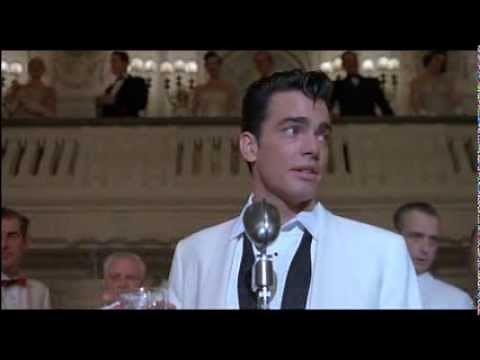 Peter Gallagher singing in The Hudsucker Proxy (1994)