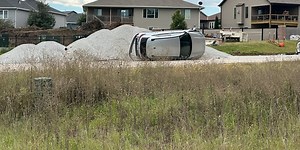 East Lincoln crash leaves car on its side