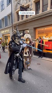 In Luzern, they have Fasnacht in February, a vibrant carnival filled with elaborate masks, extravagant costumes, and energetic Guggenmusik bands parading through the streets. We just happened to be here in January and were surprised to witness this early celebration firsthand 🎺 #luzern #switzerland | TasteTravellers