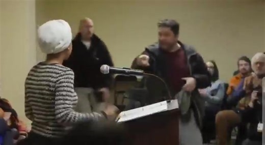 🚨#BREAKING: Watch as Democratic U.S. Representative Ilhan Omar was sprayed and targeted with an unknown liquid by an individual during a town hall meeting in Minneapolis, Minnesota. The person involved was quickly restrained by others at the event. | Joseph Molnar
