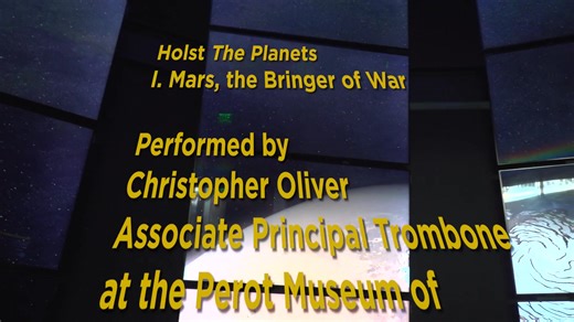 Not a bad place to warm up for Holst's The Planets.🪐 Associate Principal Trombonist Chris Oliver stopped by "Expanding Universe Hall" at the Perot Museum of Nature & Science to perform this famous excerpt from “Mars.” We’d say this is the kind of energy Holst had in mind when writing this movement! Hear the full suite with the DSO at the Morton H. Meyerson Symphony Center January 22–24. Tickets available at: dallassymphony.org/holsts-the-planets. | Dallas Symphony Orchestra