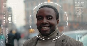 Portrait of handsome african american man smiling on camera with round frame of recognition system on his face. 3D scanning and authentication technology concept.