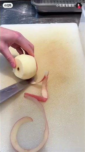 Take a knife and core the apple and cut it into small pieces and place it on a plate. #shorts #fruit