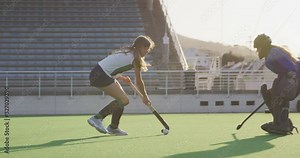 Female hockey players playing on the field Stock Video