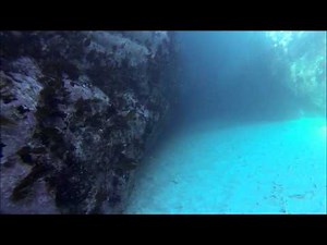 Diving through the Devil's Bellows, Kynance Cove, Cornwall, England
