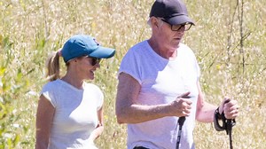 Frail David Hasselhoff, 73, walks with a cane as he's supported by wife