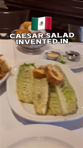 Loco Eatz on Instagram: "@caesarstijuana The Birth place of the Caesar Salad not in Italy but in Tijuana Mexico🇲🇽 📍The creation of this world wide legendary Salad was brought to Tijuana by a Italian immigrant in the 1920’s who was running low on produce so he had to improvise 🔥 #tijuana #tijuanamexico #reels #caesarsalad #reels"
