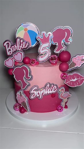 Debbie Bakes on Instagram: "I’m a Barbie Girl! Fun, cute cakes are my favourite 🩷 Toppers from the amazing @hscaketastickitchen Did you know I film all my cakes? If you’ve ordered from me, there’s a good chance your cake has its own little video! Most of them live on the other app but... would you like to see more of them here too?. . . . . . . . . . . #cakestuff #cakereel #fife #cake #americanbuttercream #caketutorial #fifecakes #celebrationcake #customcake #debbiebakes #heartcake #buttercream