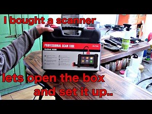 Opening box and initial setup of Autel MX808 all system OBD2 scanner