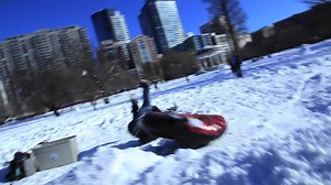 Snow Tube Rider Crashes off Ramp