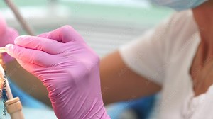 Female dentist checking up patient teeth