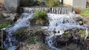 Water Diversion Culvert with Cascading Water as a Lake Receives Water Showing Erosion and Deposition Features