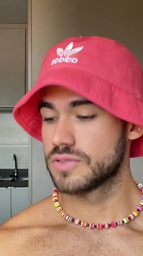 Stylish Home Look with Red Bucket Hat and Beaded Necklace