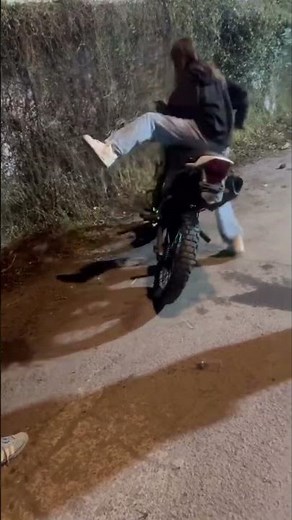Rider Tumbles Off Dirt Bike During Mounting Attempt