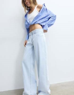 Stradivarius Low-rise double-button jeans in light bleach | ASOS