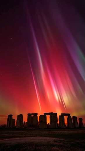 Bright Auroras over Stonehenge tonight. Go out and observe the sky tonight, as Auroras are expected to be even more vibrant. Some information about these auroras: Red auroras occur approximately 125–250 miles high, green approximately 60–90 miles, and pink around 55–75 miles above Earth’s surface. | USA Photographer